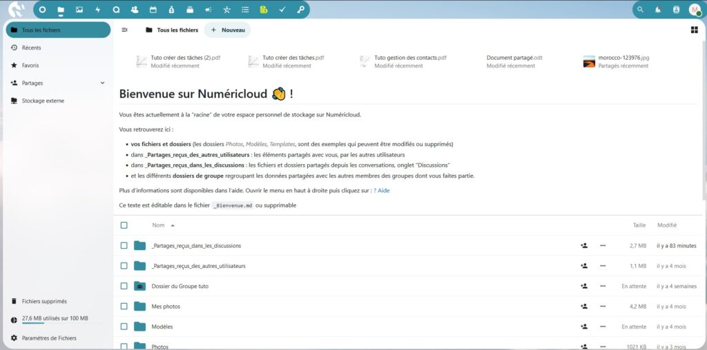 Capture d'écran de la page des fichiers de l'instance Numéricloud. Dans la barre du haut le menu. Dans le volet latéral gauche qui prend un cinquième de la page il y a les paramètres. Dans le reste de la page, un texte de bienvenue et dessous les fichiers.