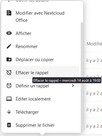 Capture d'écran de la fenêtre qui apparaît lorsqu'on clique sur les trois points. Il y a les items suivants : "Ajouter aux favoris", "Ouvrir les détails", "modifier avec Nextcloud office", "Afficher", "Renommer", "Déplacer ou copier", "Effacer le rappel", sur lequel apparaît un intitulé écrit en blanc dans un cadre sur fond noir "Effacer le rappel - mercredi 14 août à 19:00", "Définir un rappel", "Éditer localement", "Télécharger" et "Supprimer le fichier".