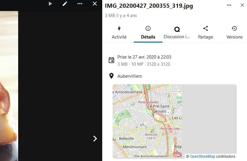 Capture d'écran de la partie droite d'une image où l'on voit différents onglets, "Activité", "Détails" (qui est ouvert), "Discussion i...", Partage" et "Versions". Dans la partie "Détails" on voit la date et l'heure de la prise de vue, le poids de l'image, le nombre de pixel, la taille et une carte OpenStreet partiellement chargée, qui est le lieu de la prise de la photo.